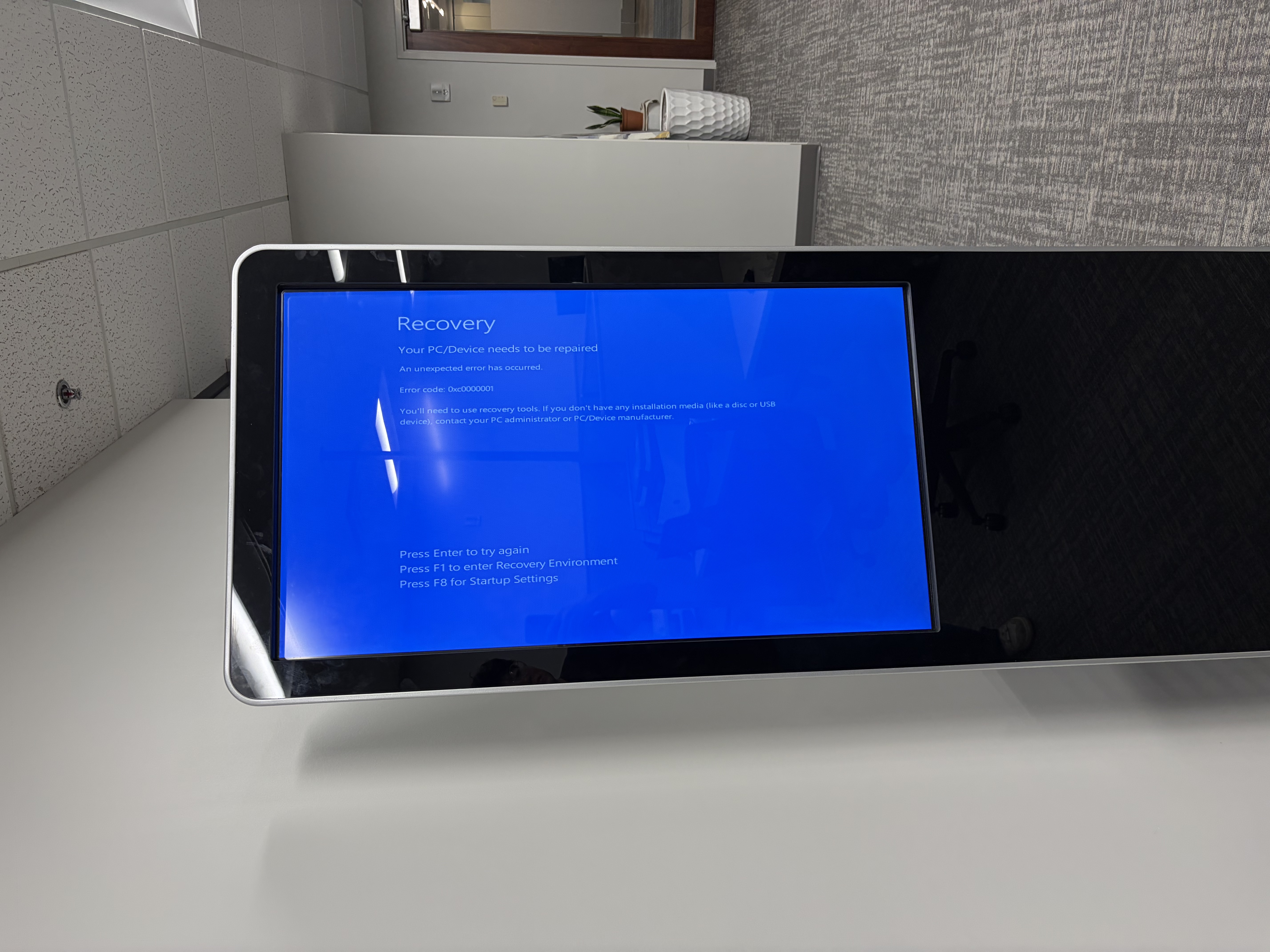 Large self-service kiosk device during testing.